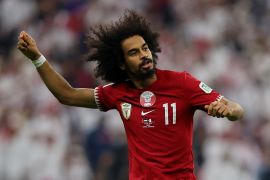 Qatar's Akram Afif celebrates scoring a goal.