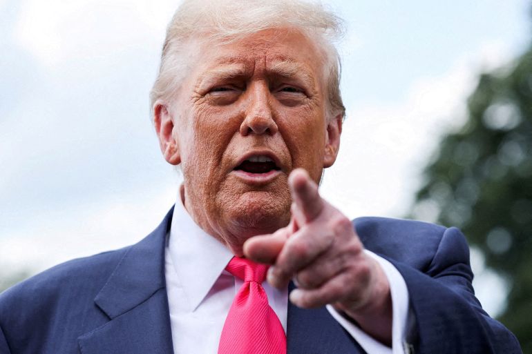 US President Donald Trump speaks with reporters.